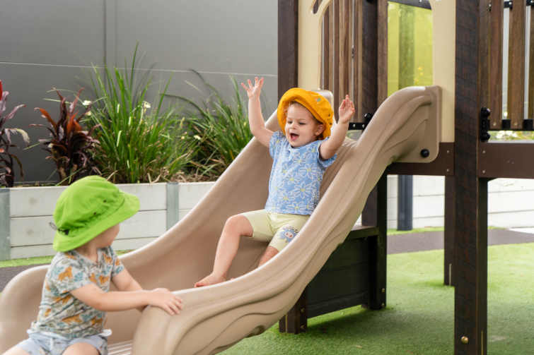 The Boulevard Early Learning Centre Mt Warren Park toddlers on slide.