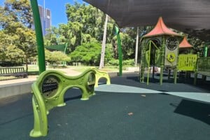 Green play equipment at Brisbane City Botanic Gardens playground.