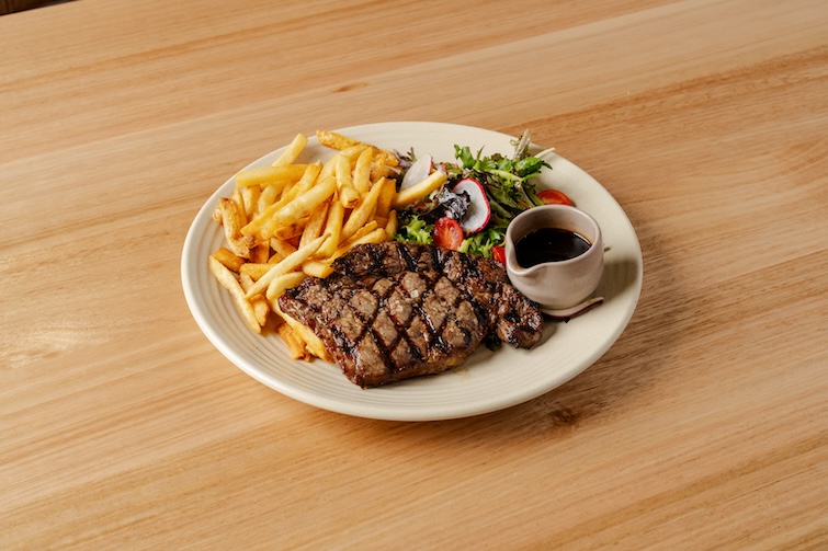 Play of steak, chips and salad at Mansfield Tavern.