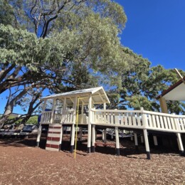 Sliding pole and wooden fort at Rotary Park (Amity Playground) in Redcliffe.