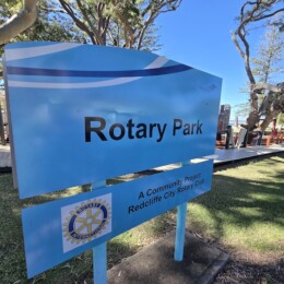 Blue Rotary Park sign at Rotary Park (Amity Playground) in Redcliffe.