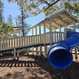 Blue tunnel slide at Rotary Park (Amity Playground) in Redcliffe.