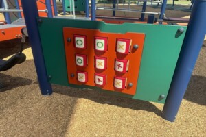 Noughts and crosses play panel at Daybreak Park, Walloon.