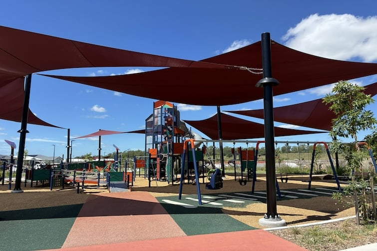 Shade sails over playground at Daybreak Park, Walloon.