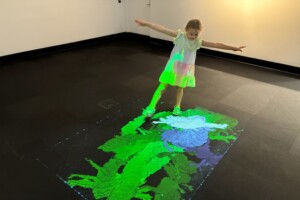 Child and interactive floor display at LightPlay, Ipswich Art Gallery.