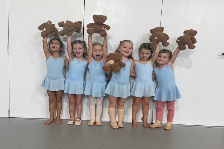 Six children striking a pose holding teddy bears at Studio One Performance Hub.