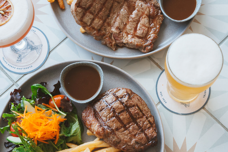 Cleveland Sands Hotel steak meal with beer.