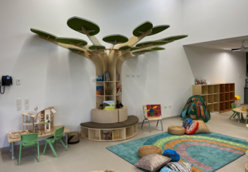 Corymbia Early Learning playroom with tree bookshelf.