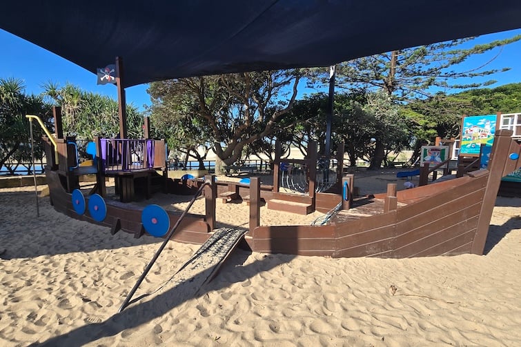 Wooden pirate ship in sand at Happy Valley Playground in Caloundra.