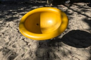 Yellow spinning bucket at Happy Valley Playground in Caloundra.