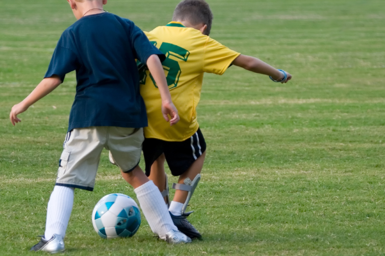 GOALS Soccer children playing soccer.