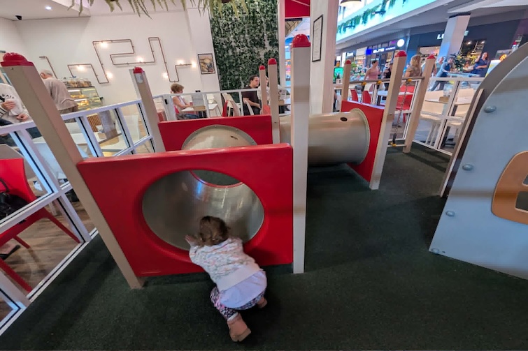 Child crawling in tunnels at Creama Espresso, North Lakes.