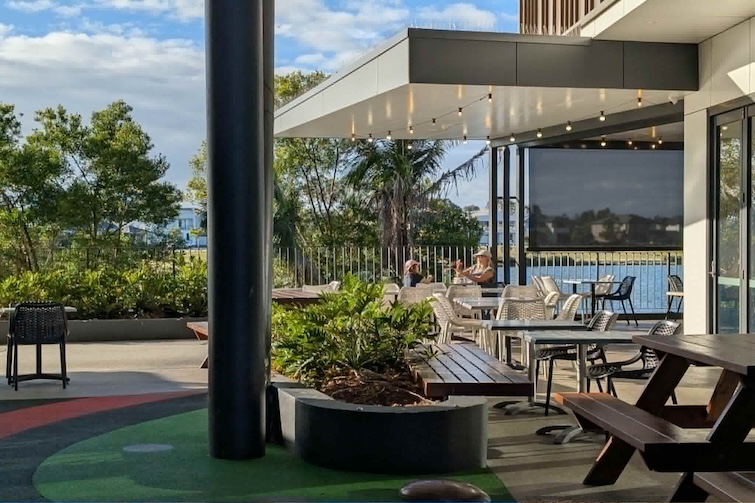 Outdoor seating with lake views at Degani Capestone.