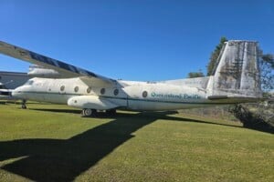 Plane on display outside on the grass at Queensland Air Museum, Caloundra.
