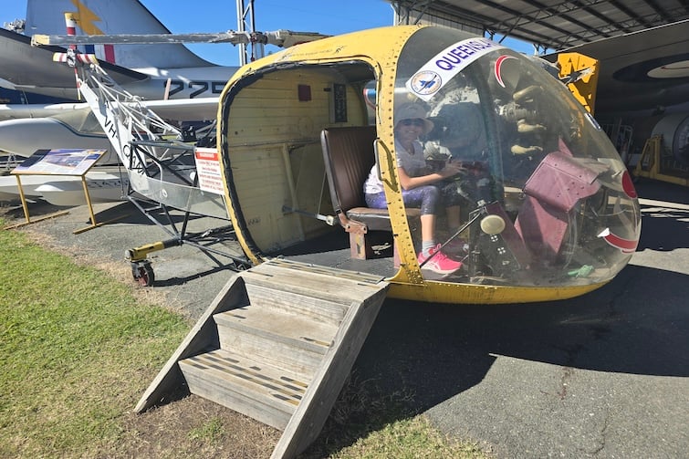 Child sitting in gyrocopter at Queensland Air Museum, Caloundra.