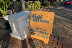 Sign board on footpath at The Full Moon Hotel, Sandgate.