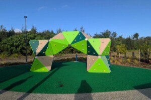 Green climbing structure at Thistle Place Park, Palmview.