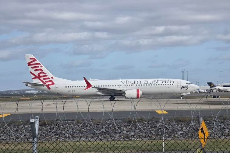 Virgin Australia plane taxiing at Brisbane Airport (view from Fellowship Place).