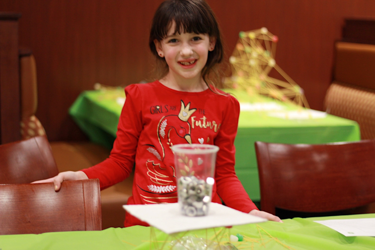 Engineering For Kids student building tower.