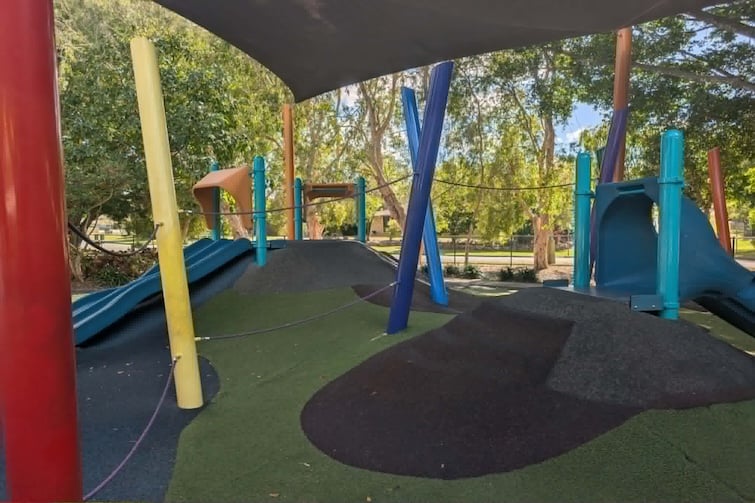 Slides and soft fall mounds at The Hills District All Abilities Park.